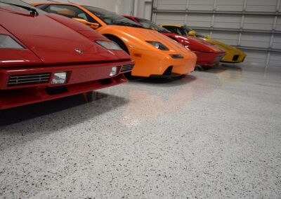 epoxy garage floor company chip systems with sports cars